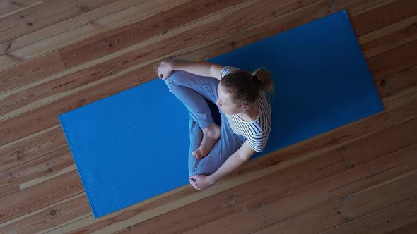Stay at Home. Woman Doing Yoga in the Living Room During Quarantine, Neck Workout Exercises