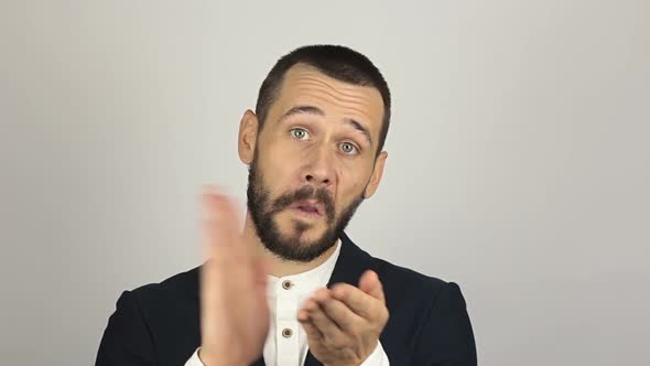 Handsome Young Man Sarcastically Smiles and Claps His Hands. alt