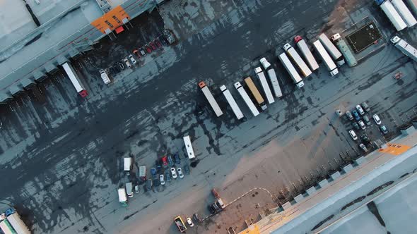 Motion Above Truck Asphalt Parking Area Between Buildings alt