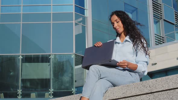 Portrait of Business Woman Finishing Work Studying Sitting in City Outdoors alt
