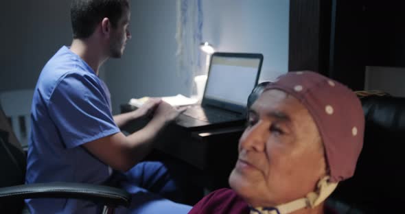  Senior patient man with a nurse in a hospital for medical evaluation using EEG 