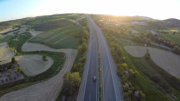 Commercial Drone Flying Over Fields, Monitoring State of Farmland Before Harvest alt