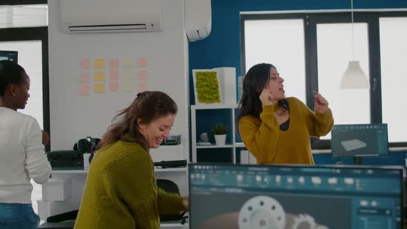 Enthusiastic Diverse Engineers Women Dancing in Company Office alt