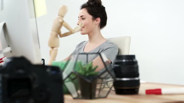 Graphic designer working on computer alt