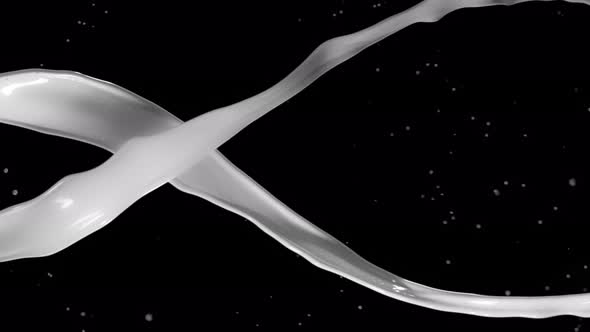 Super Slow Motion Shot of Twisting White Splash at 1000Fps Isolated on Black Background alt
