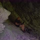 Hiker with laptop in a cool cave. Concept work from nature - VideoHive Item for Sale