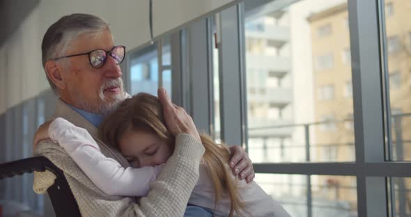 Preteen Girl Hugging Grandfather in Wheelchair Visiting at Hospital, Stock Footage