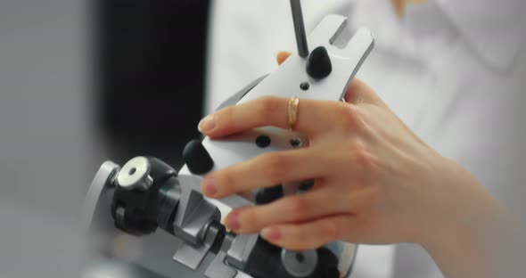 Dental Technician Makes a Plaster Cast of Jaw Models in an Articulator alt