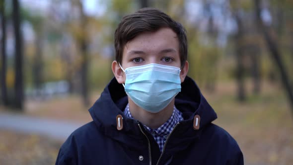 Boy in Medical Mask on the Street alt