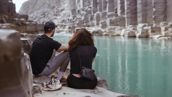 Tourists by the Rocky Boulders Along the River - Studlagil Canyon, Iceland alt
