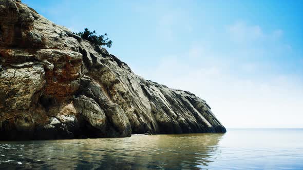 Beautiful Rocky Cliff in the Middle of the Sea alt
