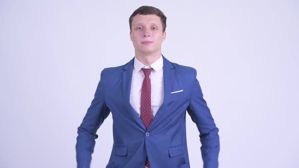 Happy Young Handsome Businessman Explaining Something alt