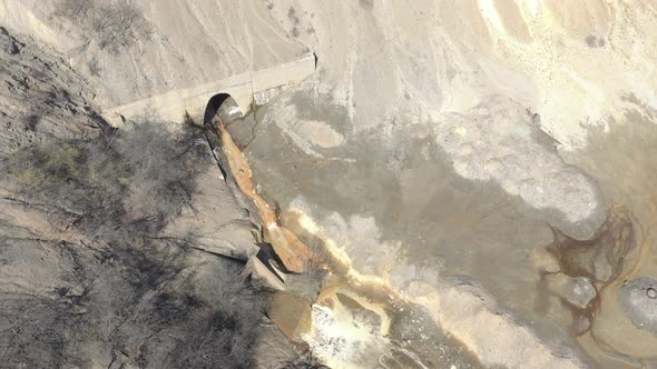 Pyrite on coastal area of polluted river with mine drainage 4K drone video alt