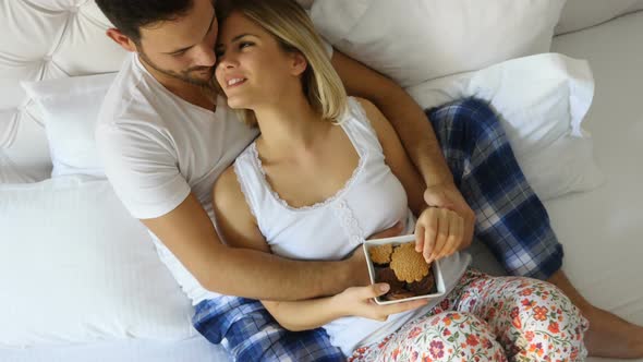Couple Eats Breakfast in Bed
