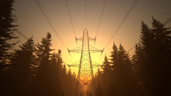 Loopable shot of high voltage electricity pylons during sunset. Orange sky. 4k alt