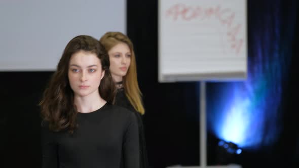 Brunette Girl on Podium Catwalk During Fashion Show Week alt