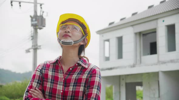 Portrait of female industrial worker on construction site