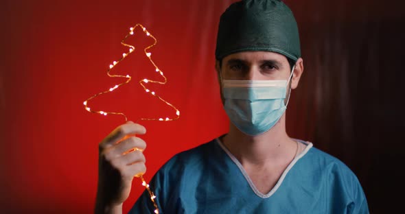 Doctor Young Boy celebrates Christmas at the time of Coronavirus alt