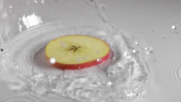 Slice of Apple and Water Spray