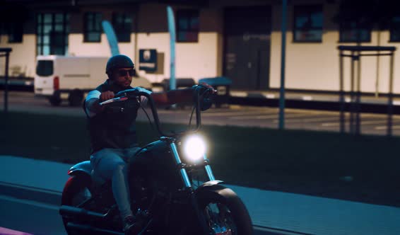 Man on a Motorbike at Night alt