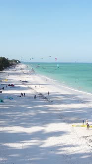 Vertical Video Kitesurfing Near the Shore of Zanzibar Tanzania alt