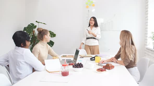 Young Caucasian Business Woman Holding Presentation of Business Project alt