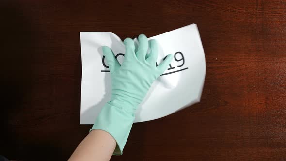 Hand in Protective Glove Take Away and Crumple Covid-19 Paper Note From Door. End of Corona Virus alt