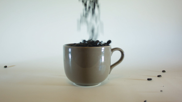 Pouring Coffee Beans In Mug