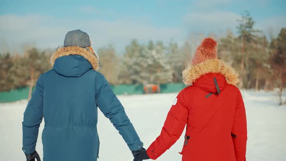 Relax Lifestyle Having Fun In Cold Day. Couple Walking And Enjoying Winter. Freezing Day On Holiday. alt