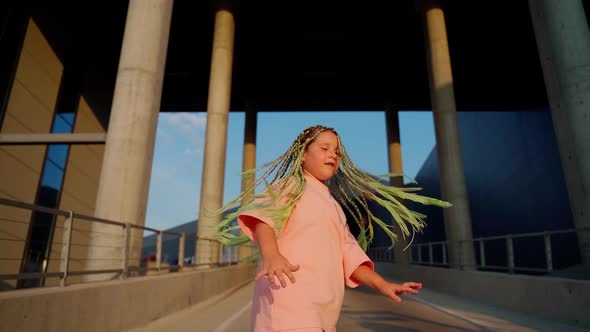 Caucasian female dance at parking. Professional dancer child express emotions using body alt