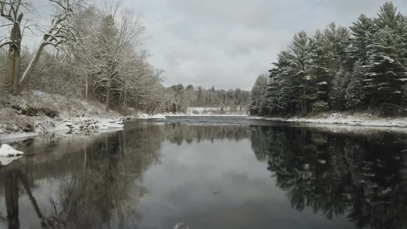 Low level flight over Piscataquis river. Maine. USA. Aerial forward alt