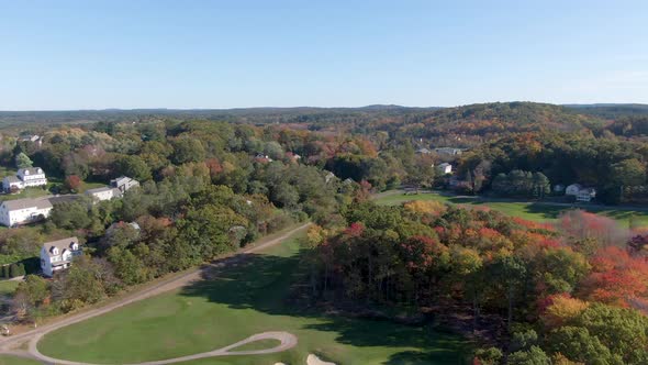 White buildings of Haverhill town and beautiful autumn colors forest landscape alt