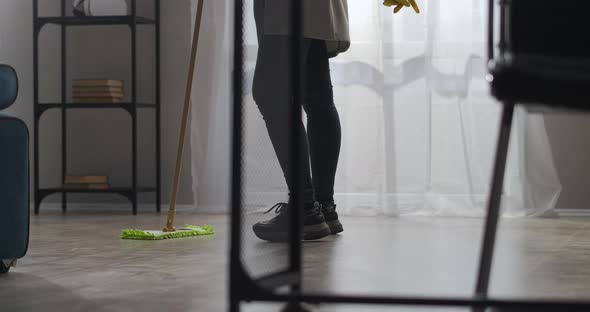 Dancing Woman Is Washing Floor in Apartment Closeup on Legs and Mop Positive and Good Mood alt