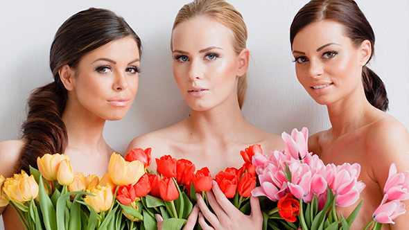 Beautiful Young Women With Tulips alt
