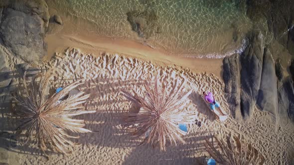 Man on Rocky Beach Aerial Shot
