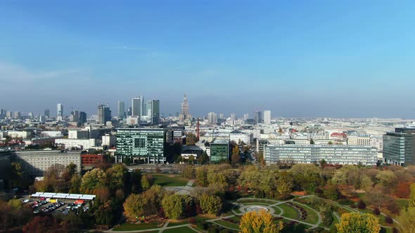 majestic Palace of Science and Culture in Warsaw City center near urban green area, aerial, modern c alt