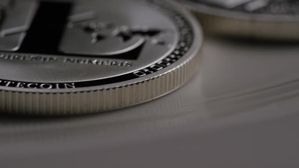 Rotating shot of Litecoin Bitcoins (digital cryptocurrency) - BITCOIN LITECOIN 0126 alt