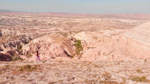 Sporty Woman Jogging Uphill Outdoors (Cinematic) alt