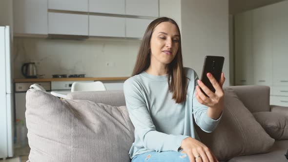 Woman Using Smartphone for Video Call