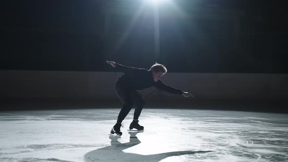 Professional Male Figure Skater Performs a Complex Figure Skating Element Flawlessly alt