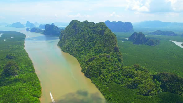 An aerial view over a large mangrove forest at Phang Nga Bay. alt