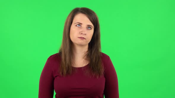 Portrait of Pretty Girl Focused Thinking About Something, No Idea. Green Screen alt