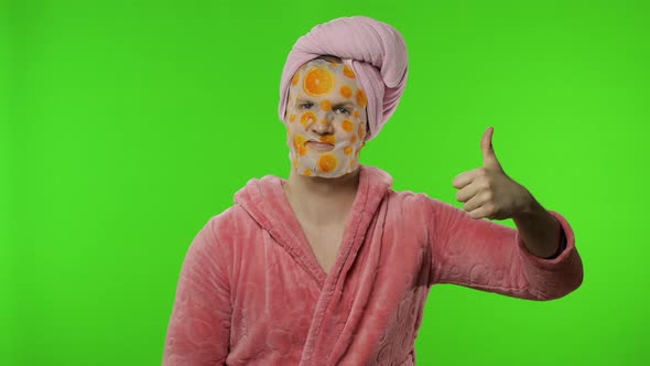 Transsexual Man in Bathrobe with Face Mask Giving Thumbs Up. Chroma Key alt