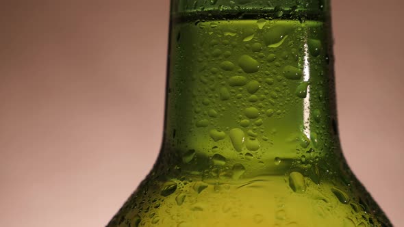 Green Beer Bottle Rotate and Close-up in Slow Motion alt
