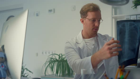 Doctor Diagnosing Online Checking Lungs Xray Close Up alt