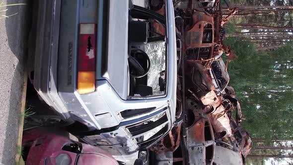 Vertical Video of the War in Ukraine  Burnt Cars in Irpin alt