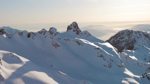 Aerial View From an Airplane of Beautiful Snowy Canadian Mountain Landscape alt