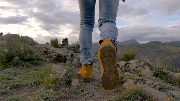 Successful Hike Active 20s Man Walk Forward Mountains To Top in Boots Step Way alt