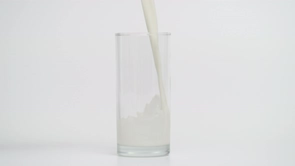 Super Slow Motion of Pouring Milk in Transparent Glass alt