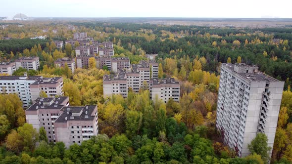 Filming From a Drone in Pripyat Overlooking the Outskirts of an Abandoned City alt